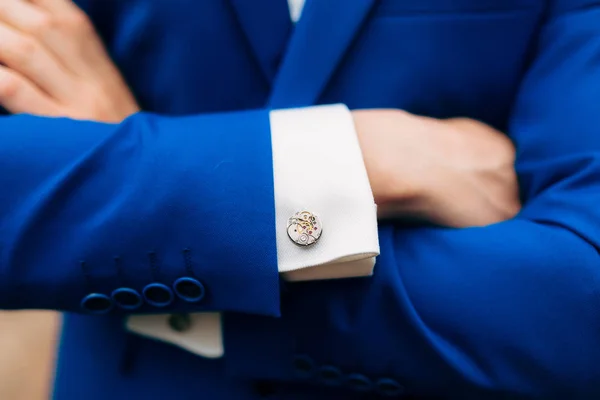 Crossed mans hands on his chest in a blue jacket. Cuff links fr — Stock Photo, Image