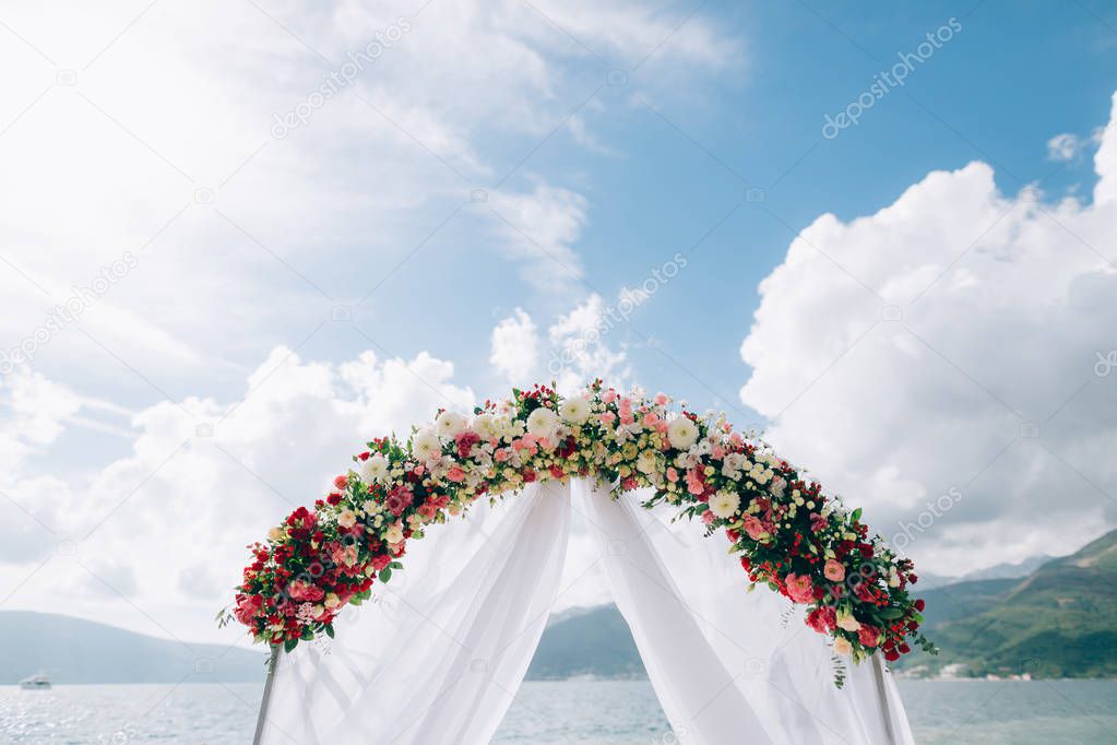 Wedding Arch on the beach in Montenegro. Panoramic views of the