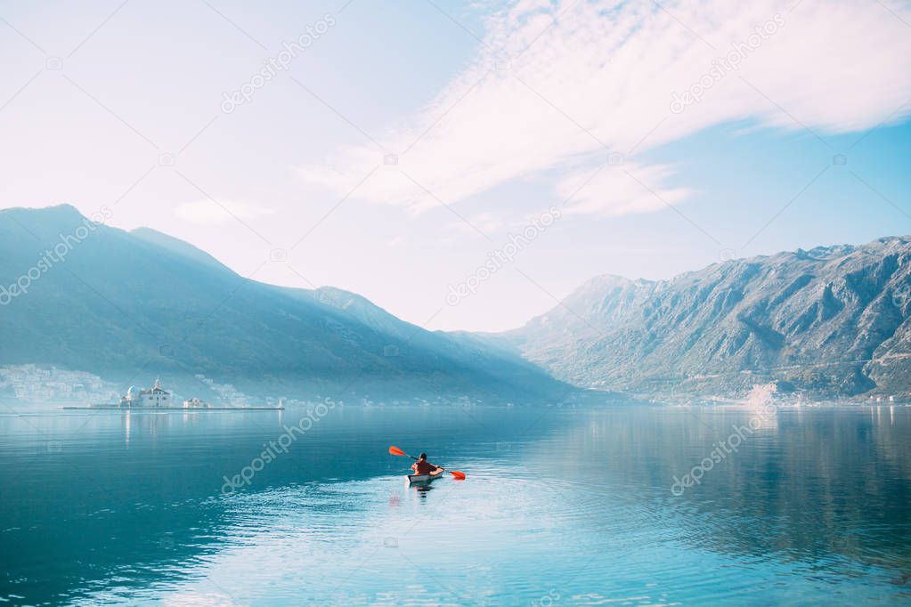 Kayaks in the lake. Tourists kayaking on the Bay of Kotor, near