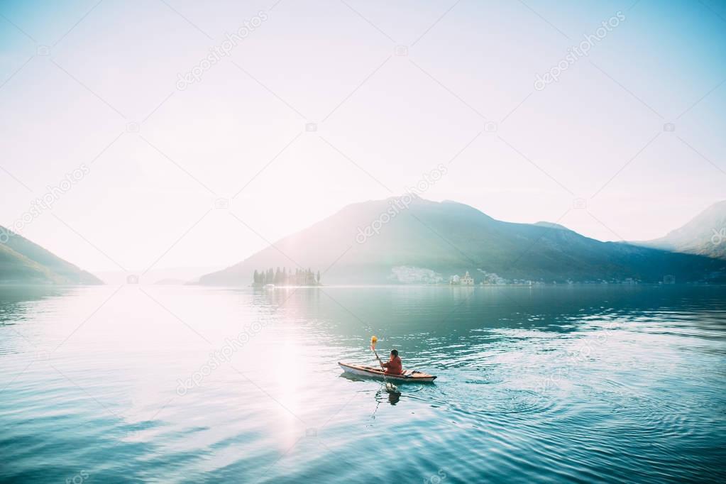 Kayaks in the lake. Tourists kayaking on the Bay of Kotor, near