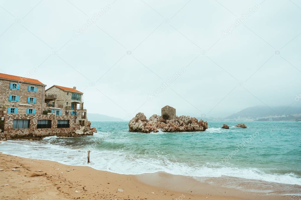 Przno, Montenegro. Beach, sun beds and umbrellas on the beach, t
