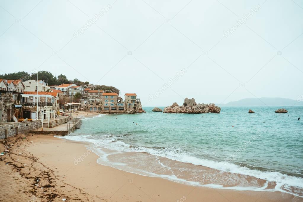 Przno, Montenegro. Beach, sun beds and umbrellas on the beach, t