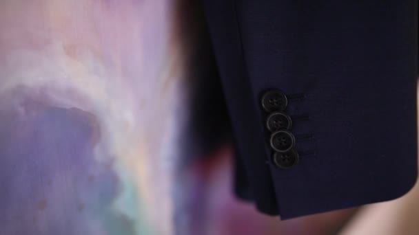 Gros plan sur les boutons d'une veste mans. La robe de mariée de la 