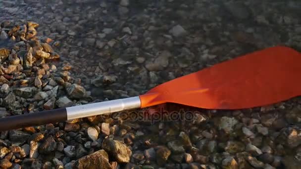 Red Boat paddle on lake. In Montenegro lakes — Stock Video