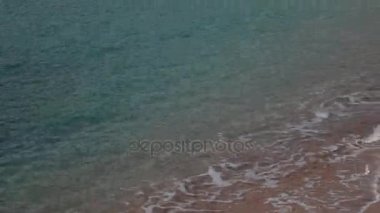 Sandy beach ve dalgalar, yakın çekim. Kum ve su doku. PICT