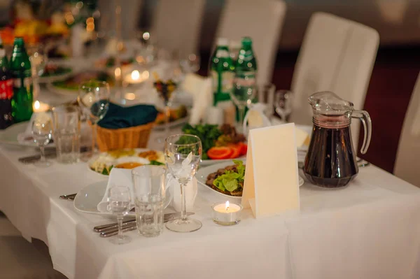 Blank bright yellow place card on wood table