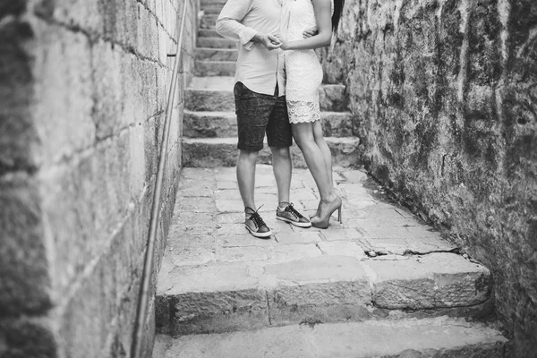 Female and male feet on the pavement — Stock Photo, Image