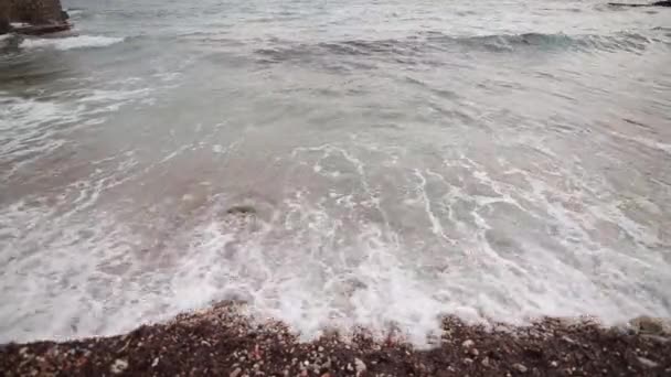Pebbles on the beach. Texture of the sea shore. The Adriatic Sea — Stock Video