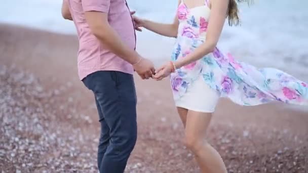 Couple on the beach in Montenegro. Newlyweds are walking on the — Stock Video