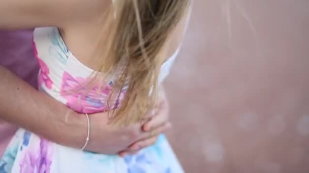 A couple on the beach hugs in Montenegro. Newlyweds are walking — Stock Video