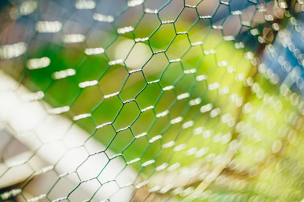 奴隷網だ。緑の背景に緑のメッシュスレーブ — ストック写真