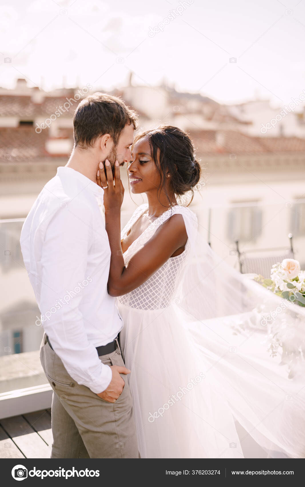 Mixedrace wedding couple. Caucasian groom and AfricanAmerican bride