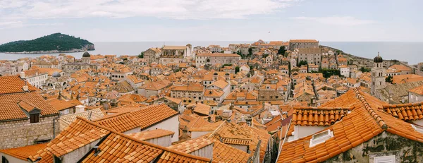Panoramic view of the whole old city of Dubrovnik. View from the wall to the tiled roofs.