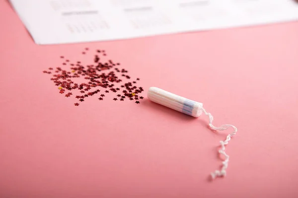 Tampon on a pink background. — ストック写真