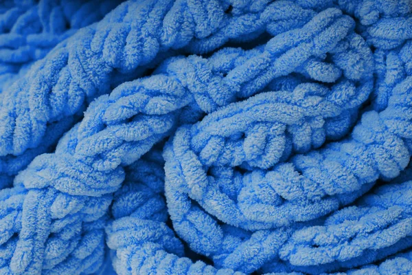 Kék kötött takaró textúrája. Kockás merinó gyapjú. — Stock Fotó