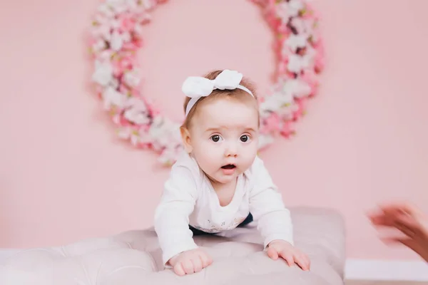 Image of sweet adorable baby girl with pink flowers — Stock Photo, Image