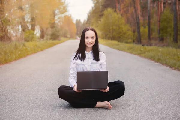 Freelancer with computer in forest ,creative solution.ideas,brainstorm.