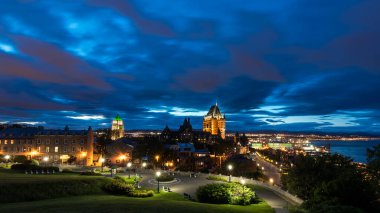 Chateau Frontenac and Old Quebec city skyline at night clipart