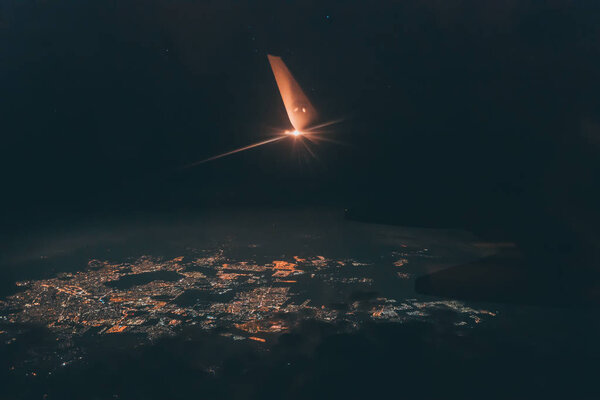 Plane wing city lights Royalty Free Stock Images