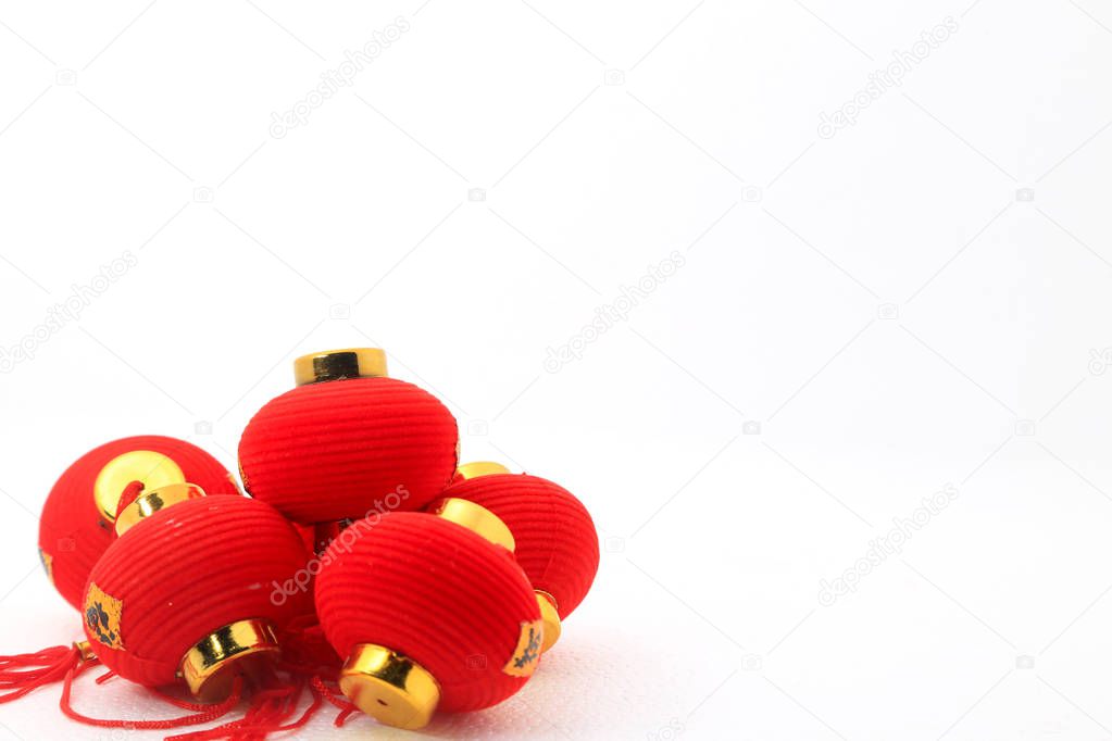 Group of small red Chinese lanterns for decoration over white background.  The chinese word means fortune.