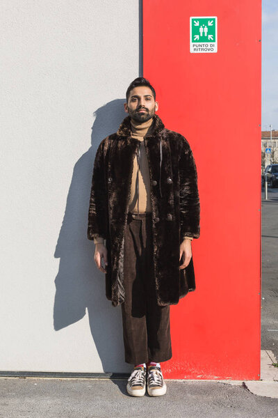 Young Indian man posing in an urban context