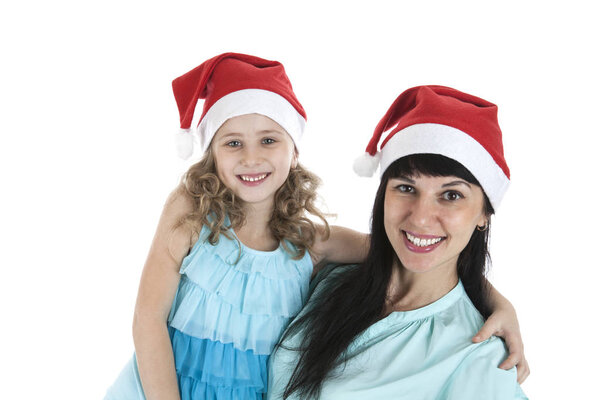 mother with a little daughter in Christmas caps