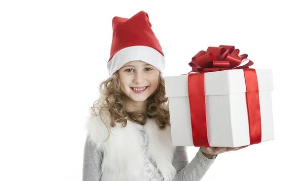 Little girl in a Christmas cap with a gift box — Stock Photo, Image