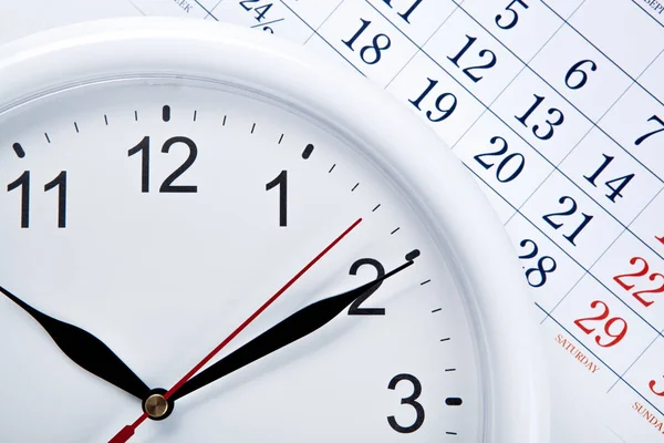 Relógio rosto e folha de calendário com números — Fotografia de Stock