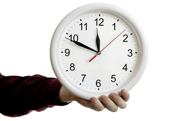 Grande orologio rotondo volto nella mano dell'uomo su uno sfondo bianco — Foto Stock