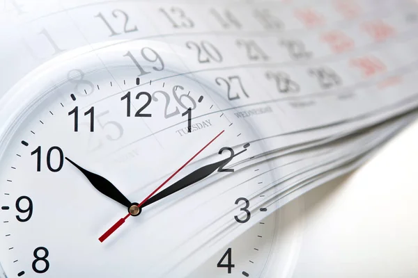 Wall calendar with the number of days and clock — Stock Photo, Image