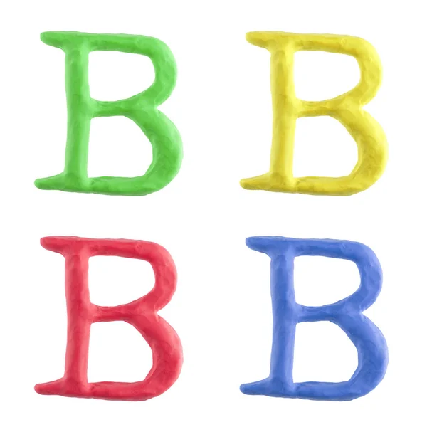 一个自定义大写字母 手由橡皮泥用四种不同的颜色制成 这个独特的字符是孤立的白色背景 — 图库照片