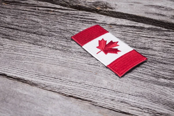 Embroidered Canadian Flag Patch Sits Rustic Wooden Background — Stock Photo, Image