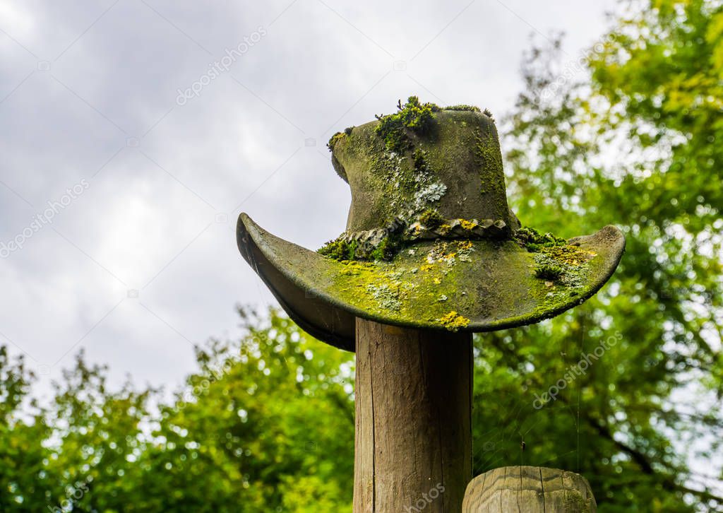 weathered cowboy hat on a wooden pole, Garden decoration in western style