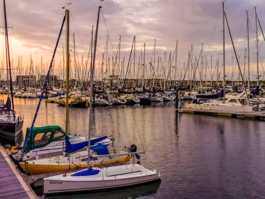 Ships in the water in harbor of Sint Annaland during sunset, touristic town in zeeland, The Netherlands, 24 july, 2019