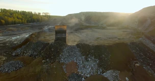 Yellow truck unloads the ground with stones — Stock Footage Yellow truck unloads the ground with stones Video Clip