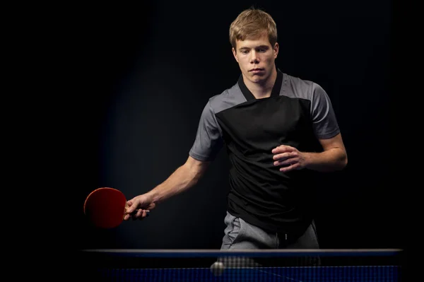 Portrait of young man playing tennis — Stock Photo, Image