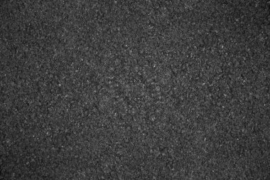 Asfalt arka plan dokusu ile bazı ince taneli sarı çi ile