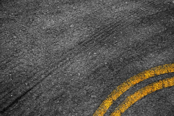 Asphalt background texture with some fine grain with Yellow Stri — Stock Photo, Image