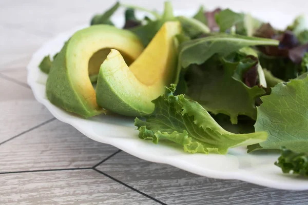 Salad avoado on the white plate — Stock Photo, Image