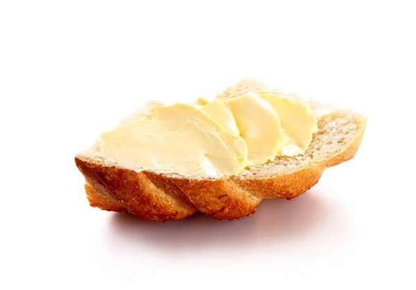 Mantequilla sobre pan aislado fondo blanco — Foto de Stock