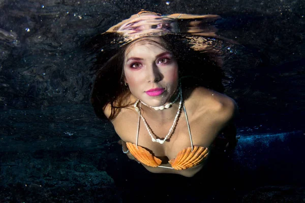 Mermaid swimming underwater in the deep blue sea — Stock Photo, Image