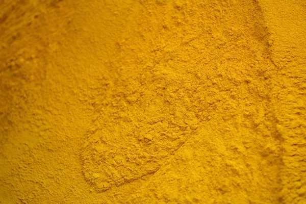 Turmeric powder background yellow detail — Stock Photo, Image