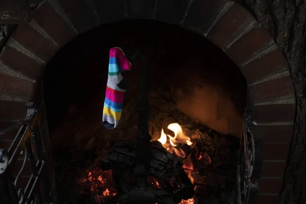 Traditional xmas epiphany socks hanging on fireplace — Stock Photo, Image