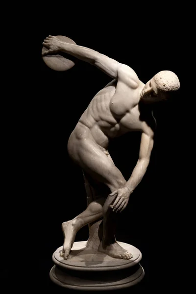 Discus thrower ancient marble statue isolated on black — Stock Photo, Image