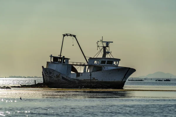 Fishing boat wreck on the rocks — Stock Photo, Image