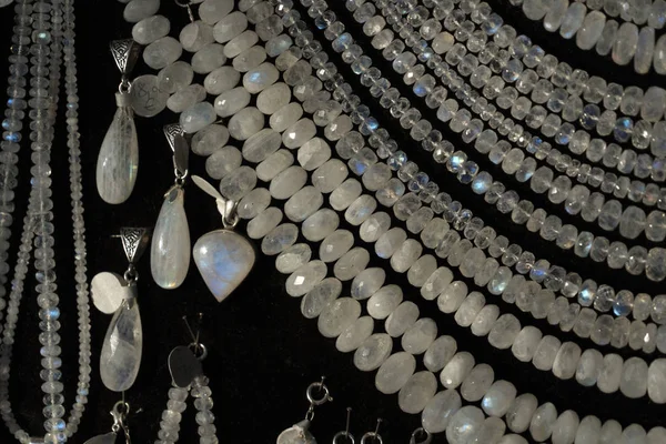 Rainbow moonstone necklage earrings jewelry on display stand in a shop market — Stock Photo, Image