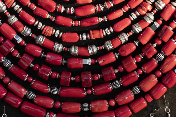 Coral necklage earrings jewelry on display stand