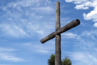 wood cross on sky background