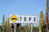 Baja california mexico tope sign in english bump road sign