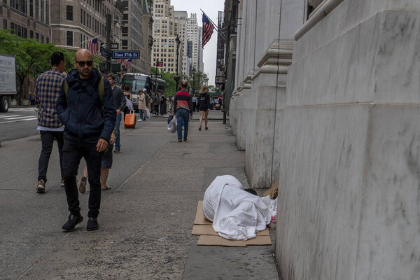 NEW YORK, USA MARCH 27 2020 - covid homeless in new york usa 5th avenue